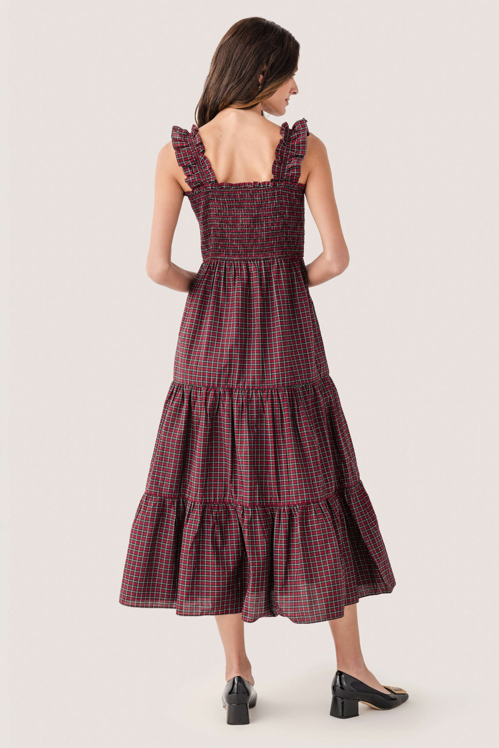 Back view of red and green tartan smocked midi dress with tiered skirt
