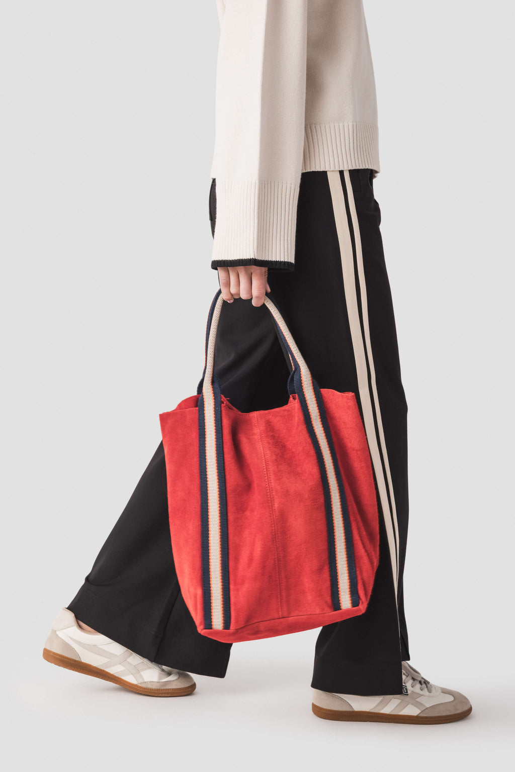 Red suede leather tote bag with contrast stripes and sturdy top handles