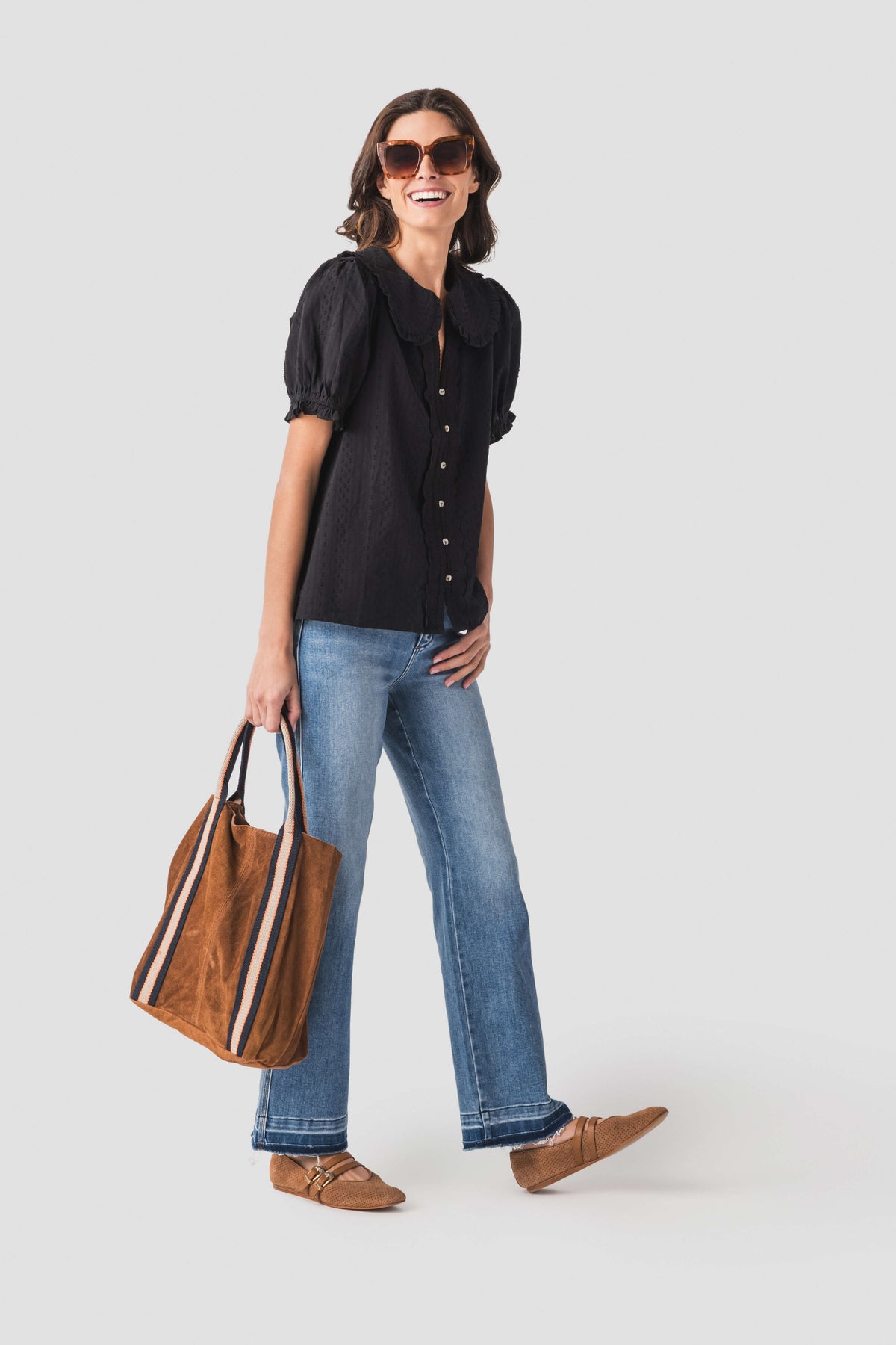 Tan suede leather tote bag with striped trim, open top, and two handles