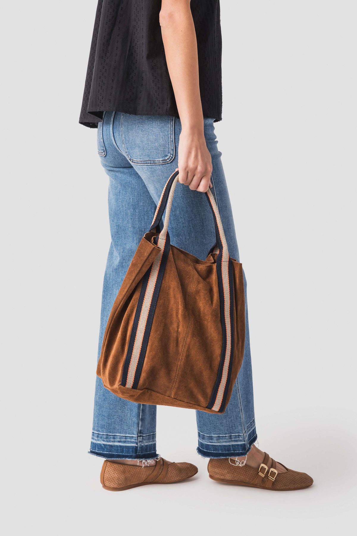 Brown suede leather tote bag with striped trim and side panel detail
