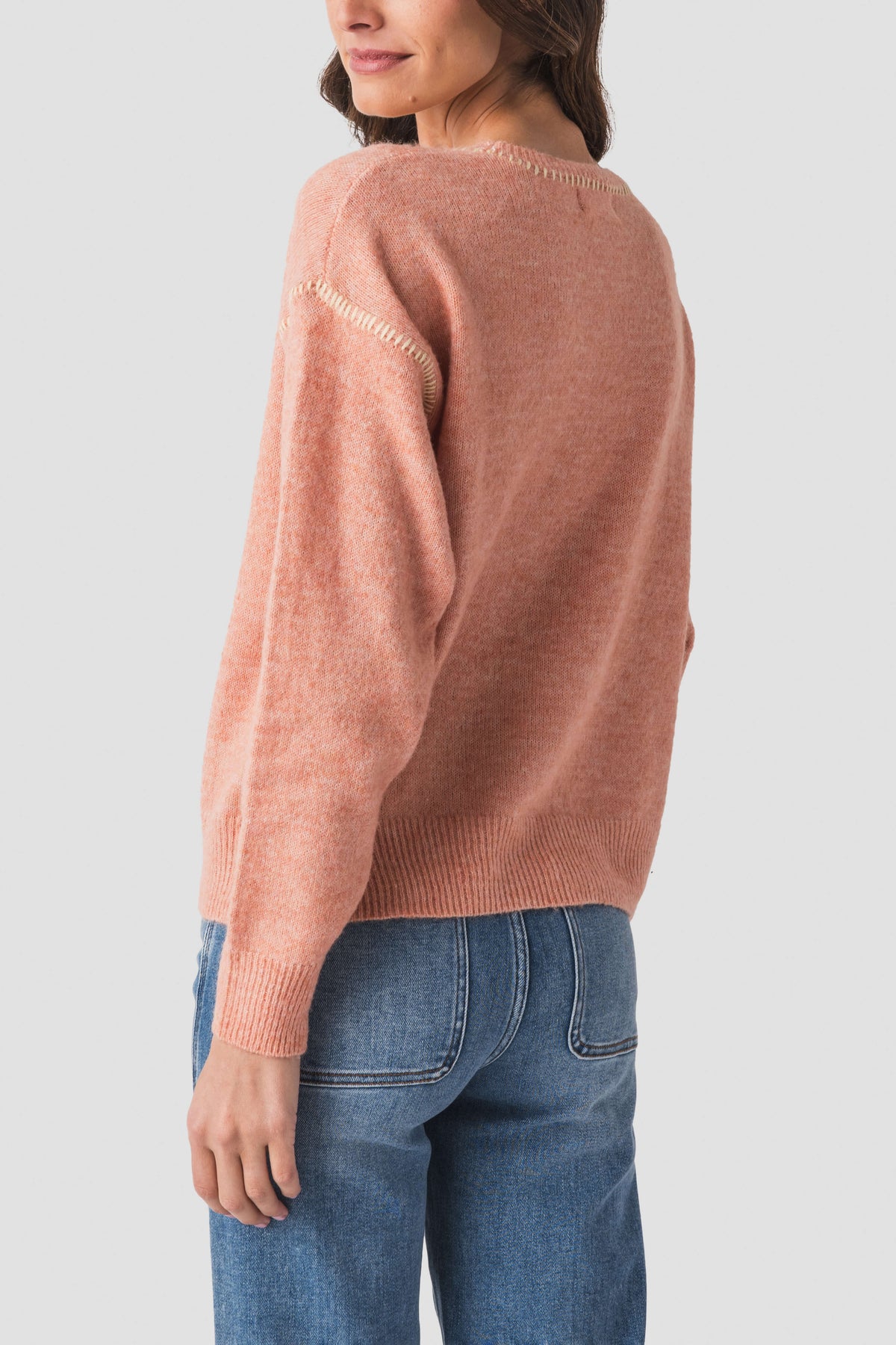 Dusty coral crewneck sweater with contrast stitch, ribbed cuffs and neckline
