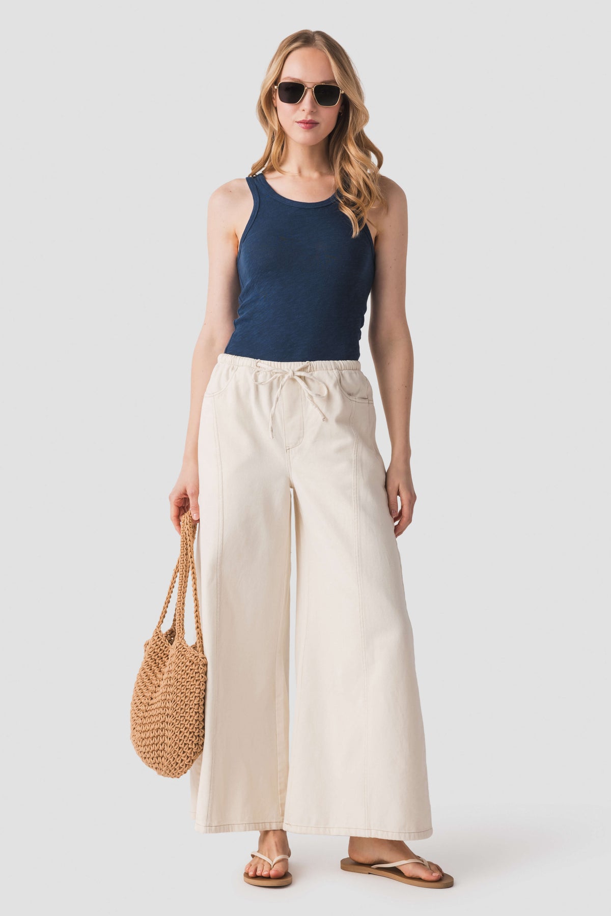 Indigo slub scoop tank top, sleeveless with crew neckline and fitted cut.