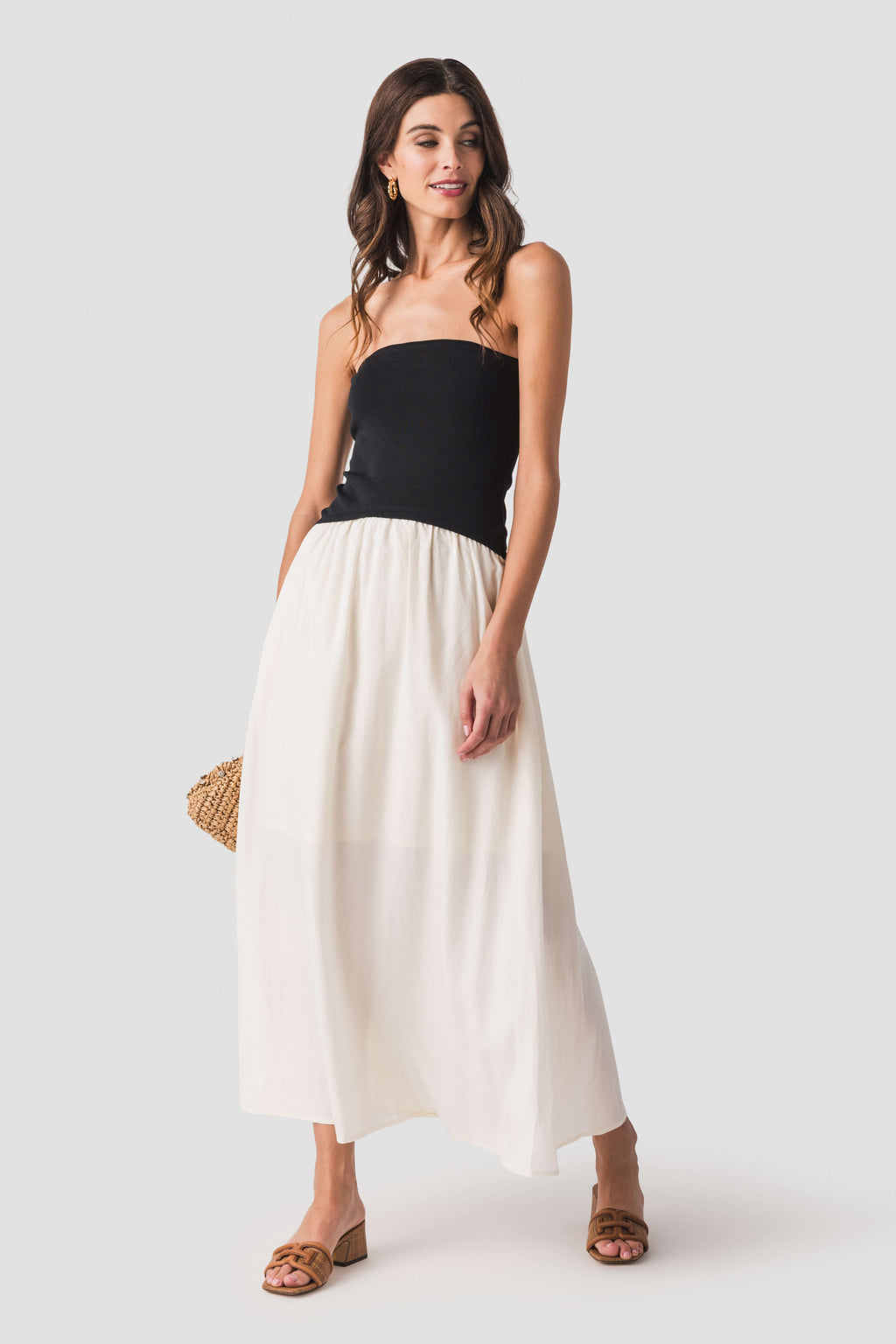 Two-tone strapless midi dress with black fitted bodice and cream gathered skirt