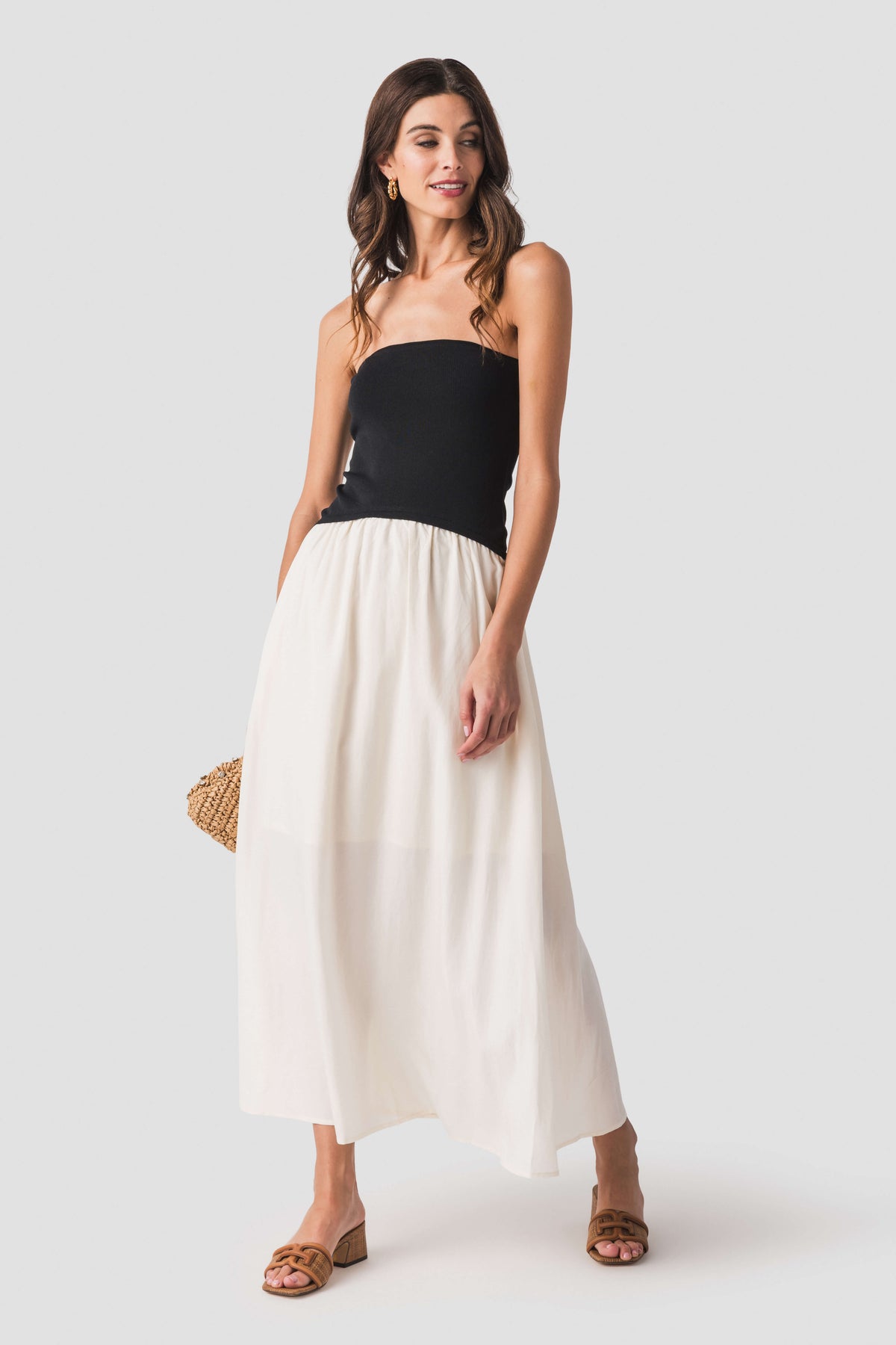 Two-tone strapless midi dress with black fitted bodice and cream gathered skirt