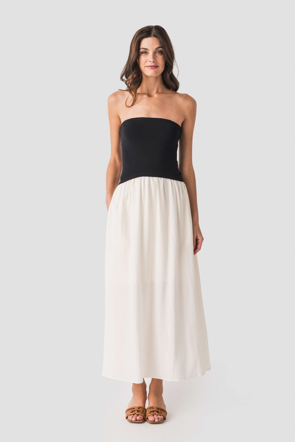 Strapless two-tone midi dress with black bustier top and cream skirt