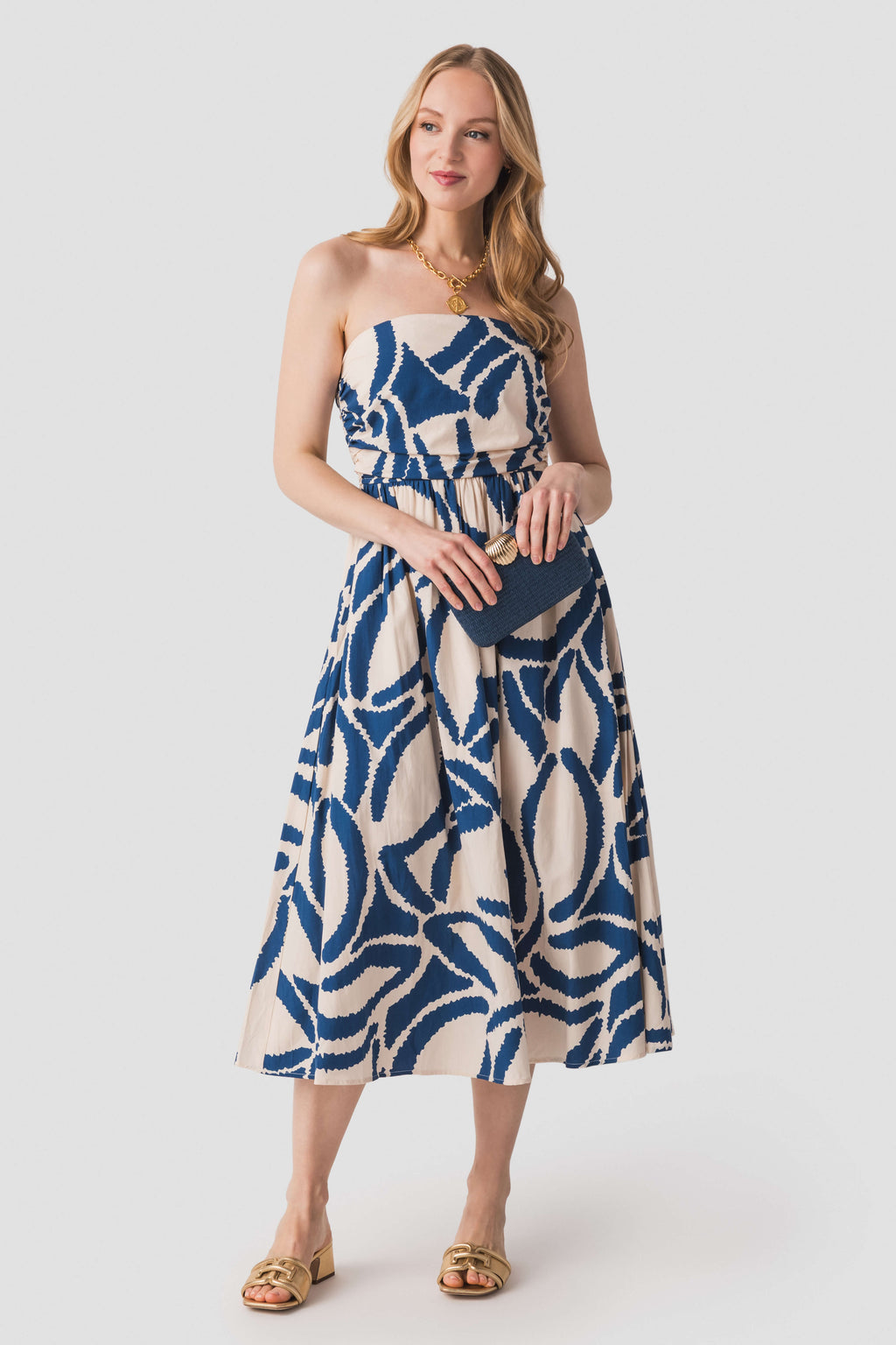 Tube top midi dress with blue-and-white abstract print, smocked waist detail and flared skirt