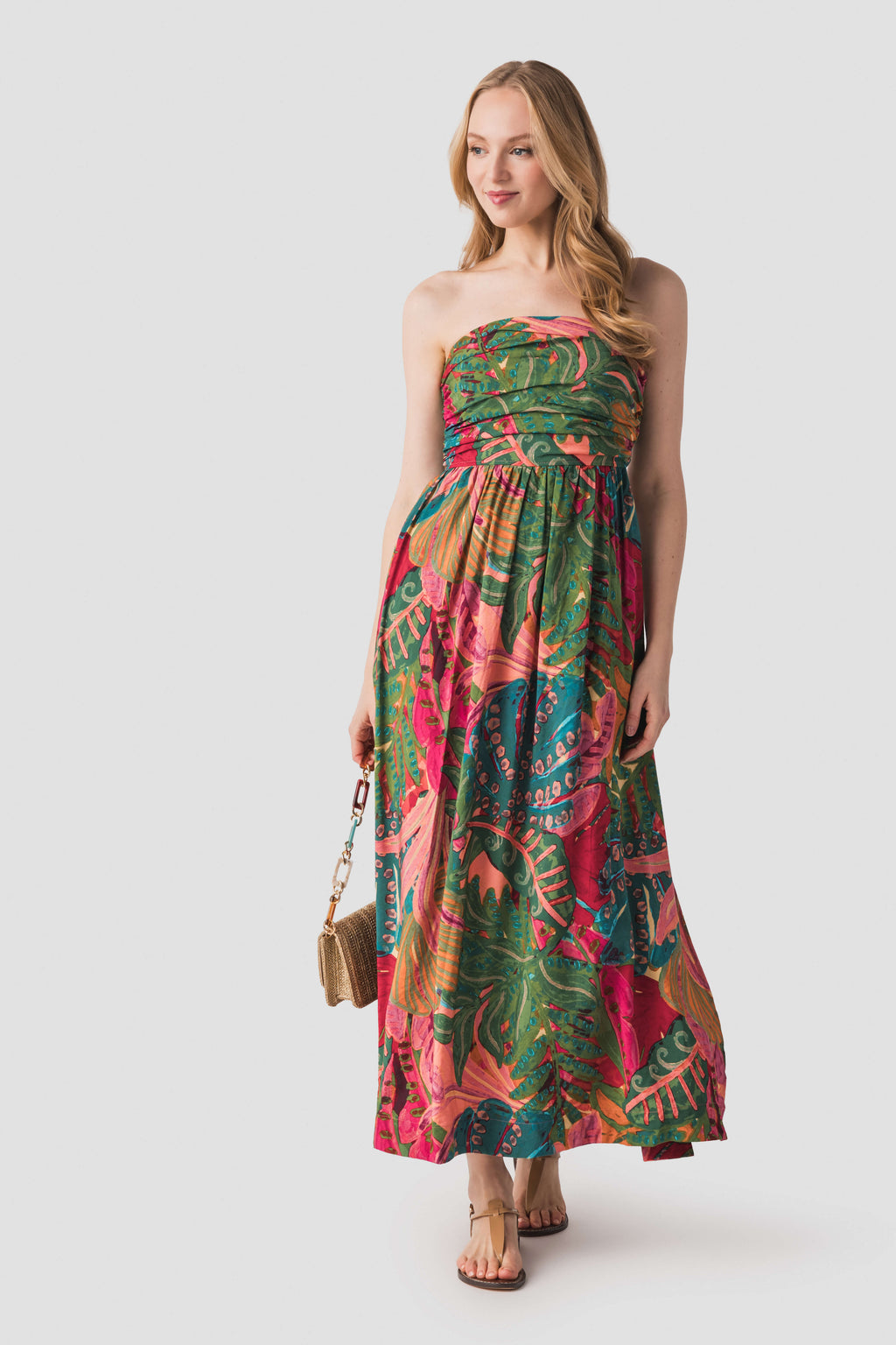 Strapless ruched maxi dress with tropical print, gathered bodice and long skirt.