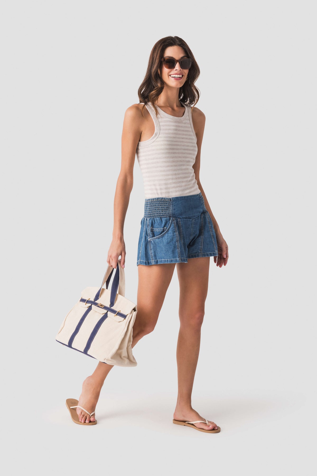 Cream tote bag with navy striped sides and sturdy top handles