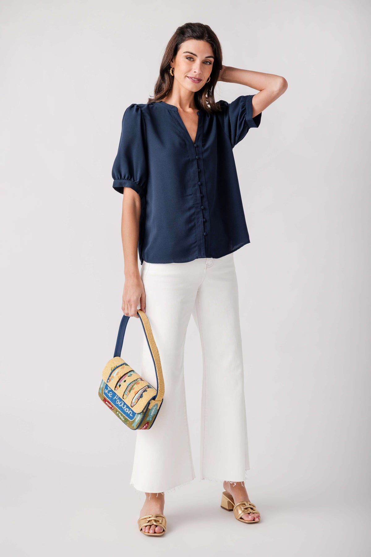 Navy puff-sleeve blouse top with V-neck and button front