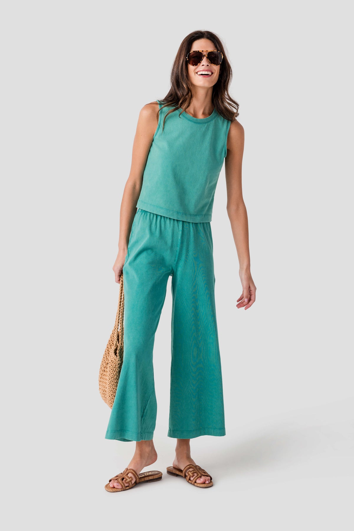 Teal sleeveless crewneck jersey set: muscle tank with gathered waist, wide-leg pants.