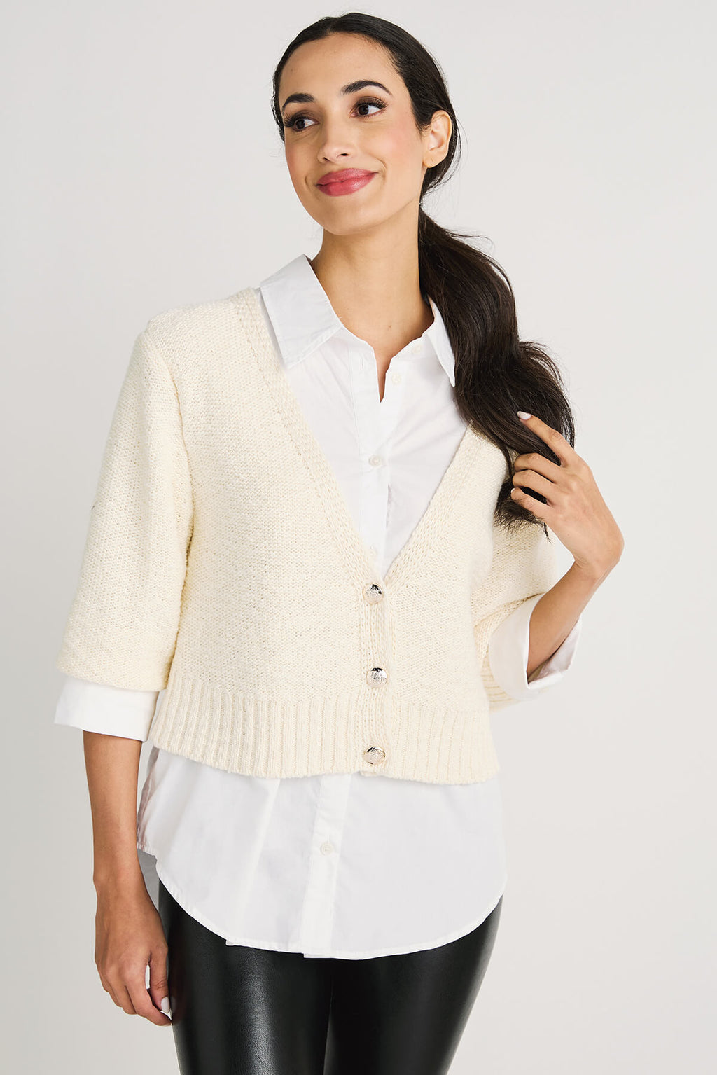 Off-white cropped knit cardigan sweater with V-neck, button front, and ribbed hem