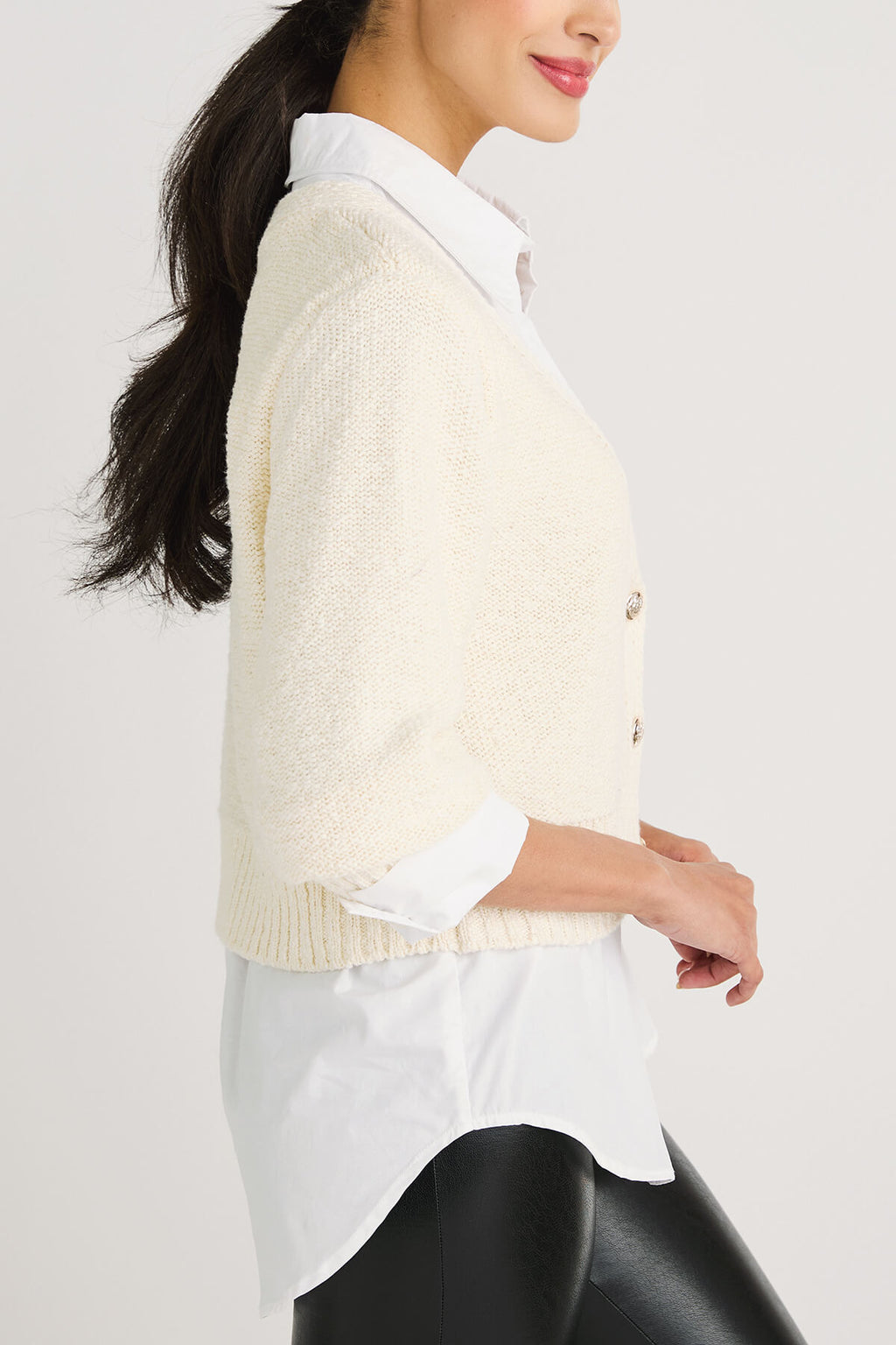 Off-white cropped cardigan sweater sleeve view with ribbed cuff and button detail