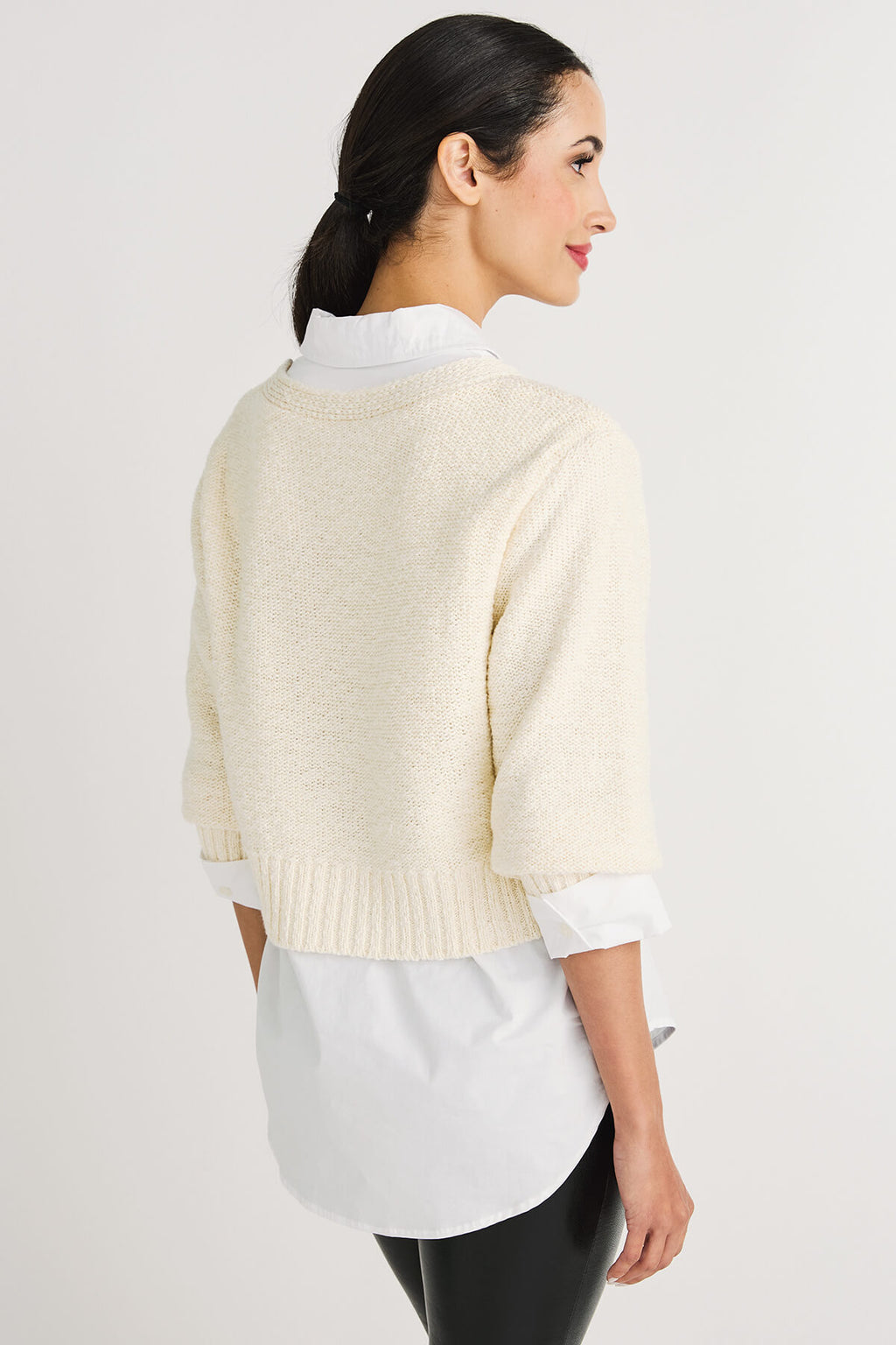 Off-white cropped knit cardigan sweater, back view with ribbed hem and short sleeves