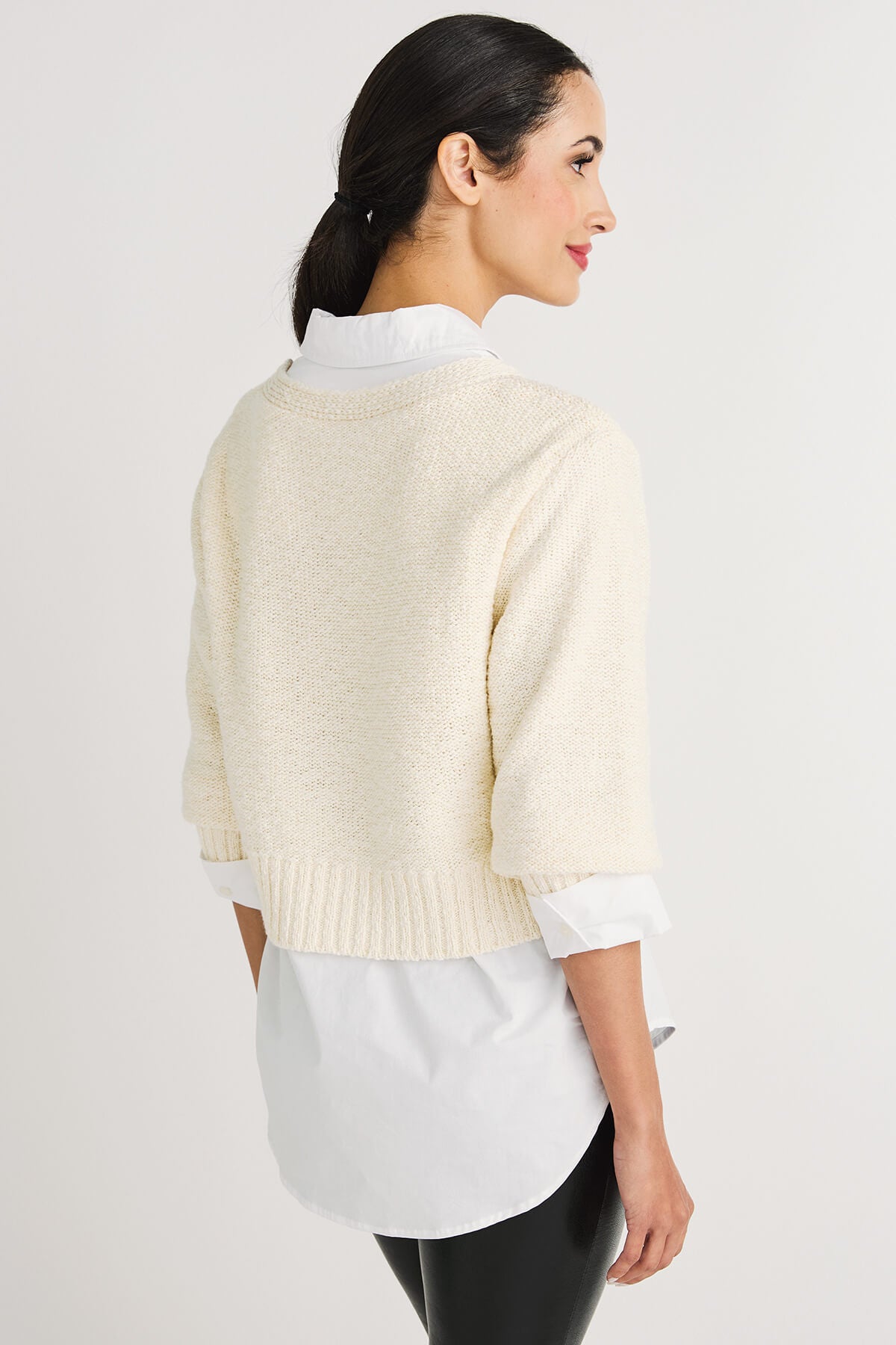 Off-white cropped knit cardigan sweater, back view with ribbed hem and short sleeves