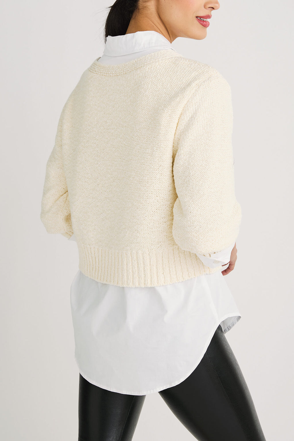 Off-white cropped cardigan sweater back view with ribbed waistband and knit texture