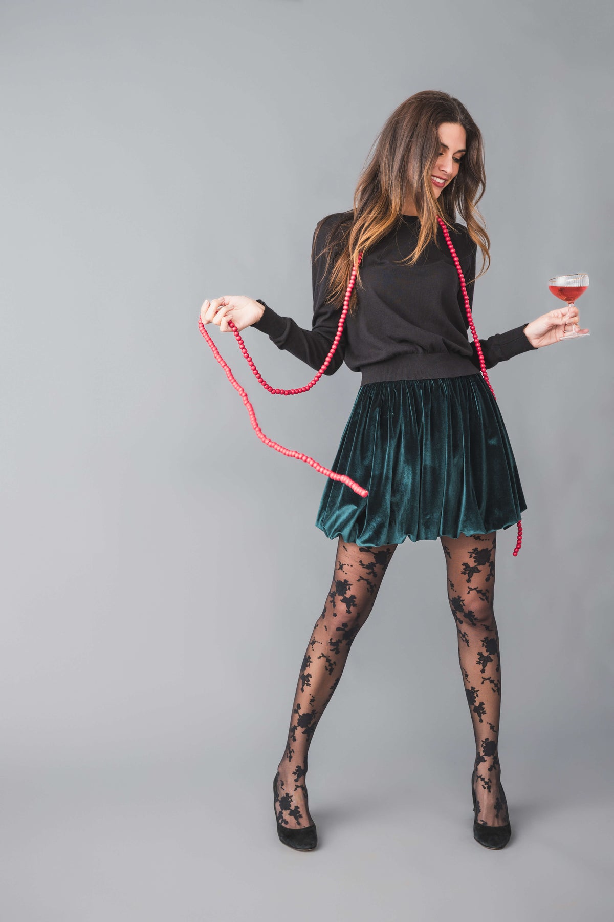 Hunter green velvet mini bubble skirt with gathered waist and flared pleats