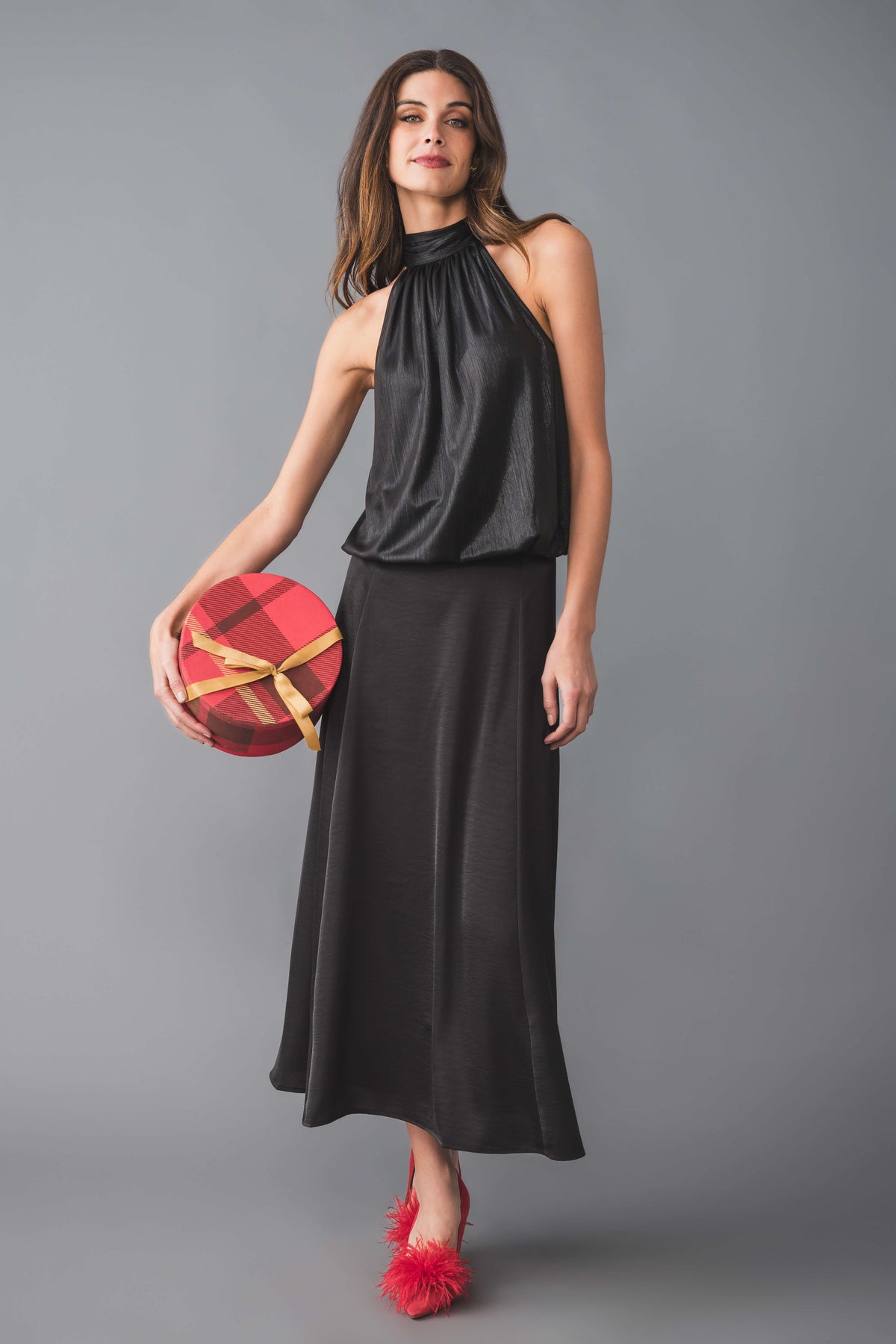 Black liquid halter tie-neck top with draped front and sleeveless design
