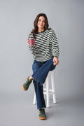 Green and white striped knit cardigan with button front and long sleeves