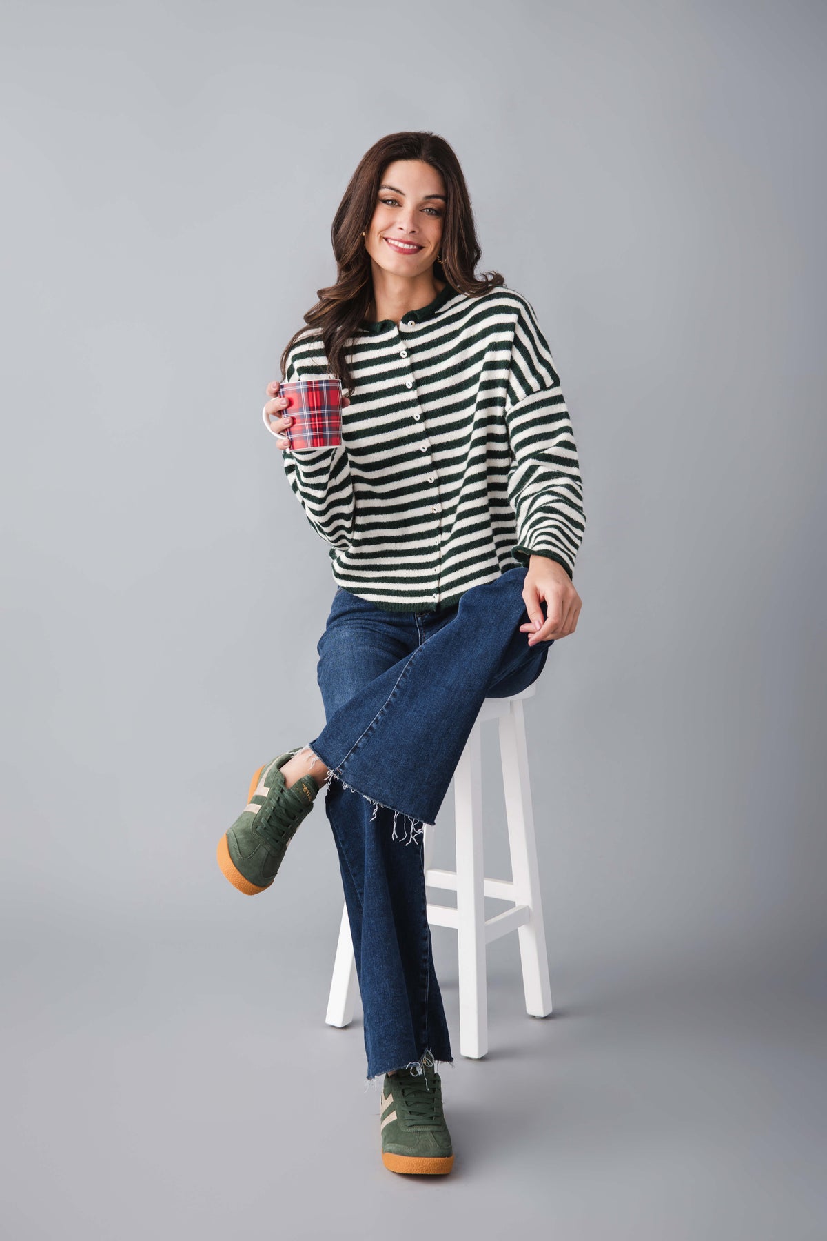 Green and white striped knit cardigan with button front and long sleeves