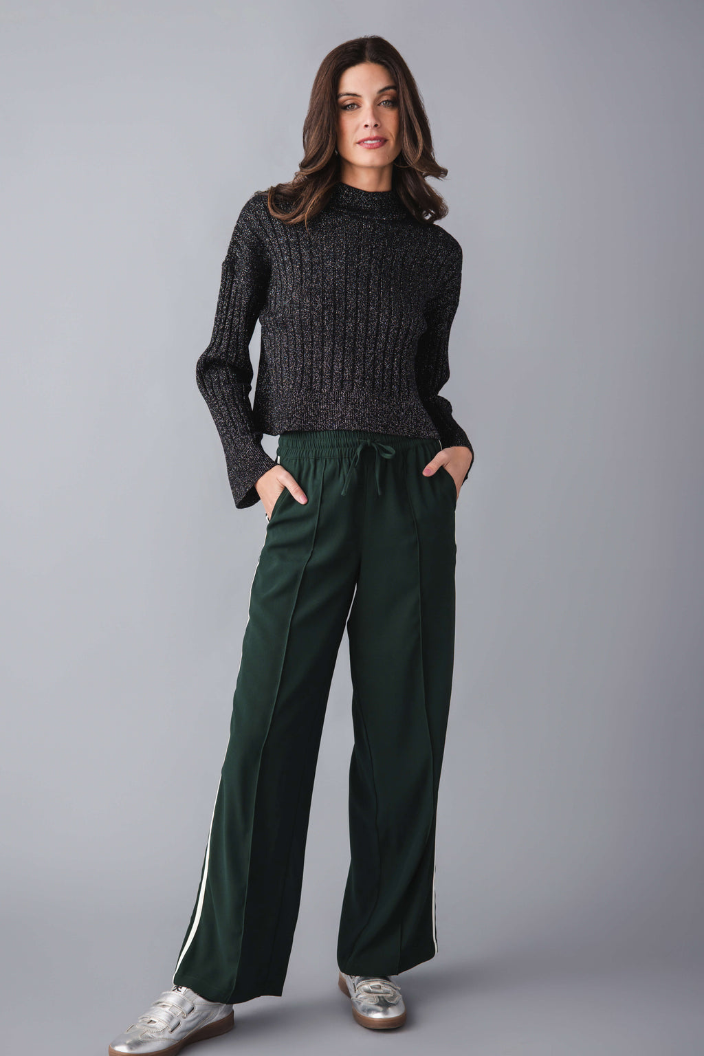 Dark charcoal ribbed knit turtleneck pullover with long sleeves, hip-length fit