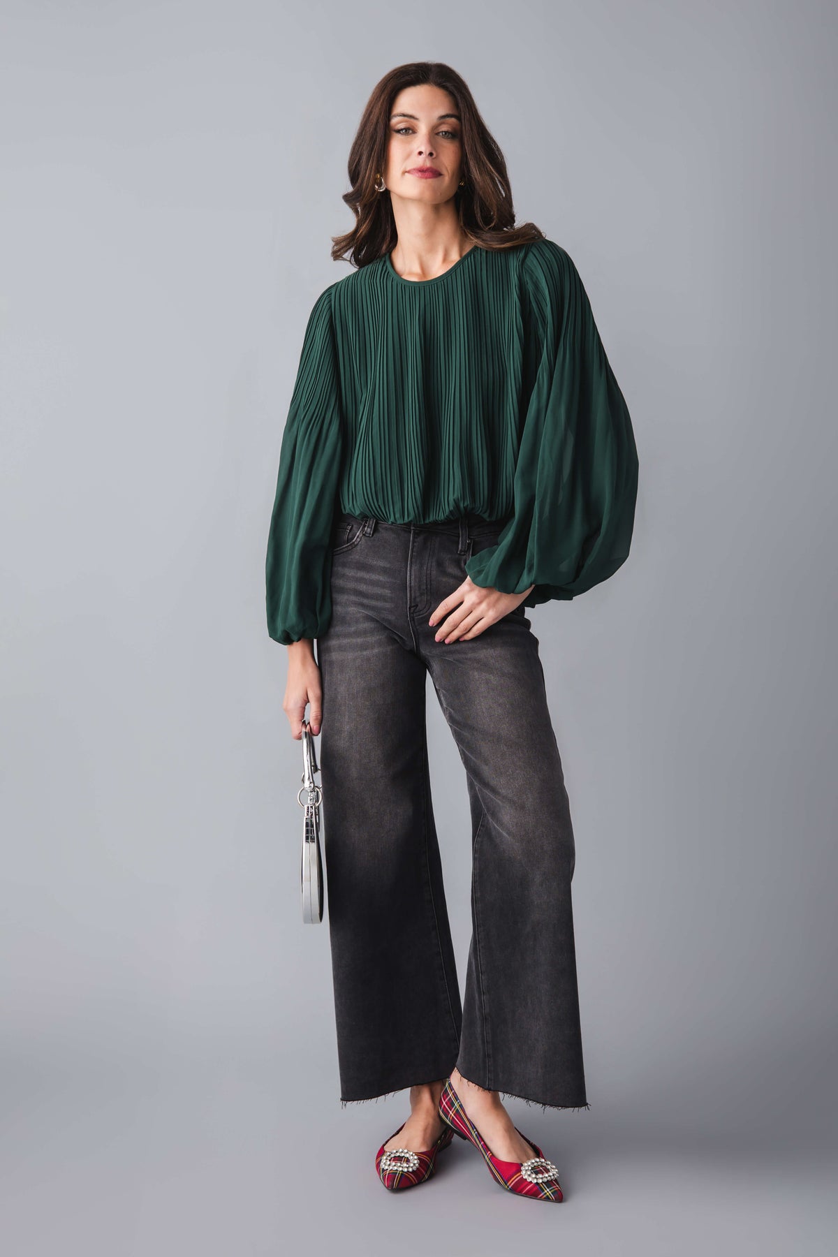 Pine green bubble hem top with vertical pleats and long puff sleeves