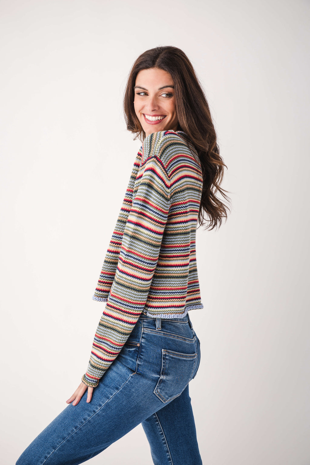 Multicolor striped rollneck sweater, side view showing long sleeves