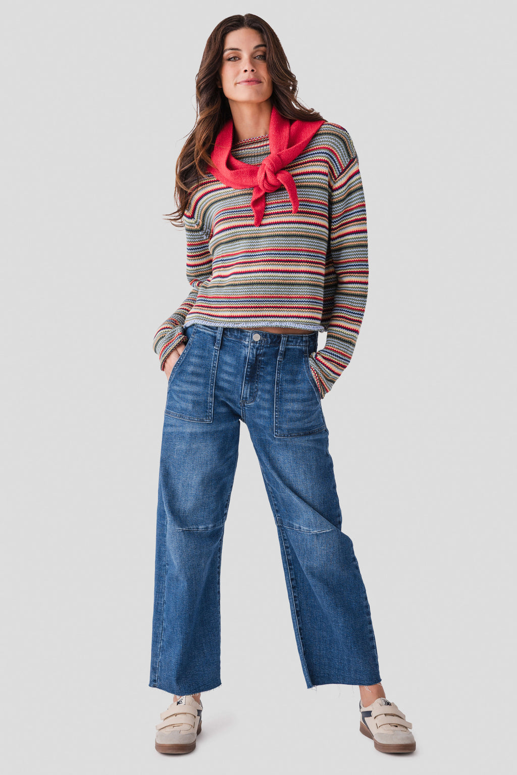 Multicolor striped rollneck sweater on a model, long sleeves and rib trim
