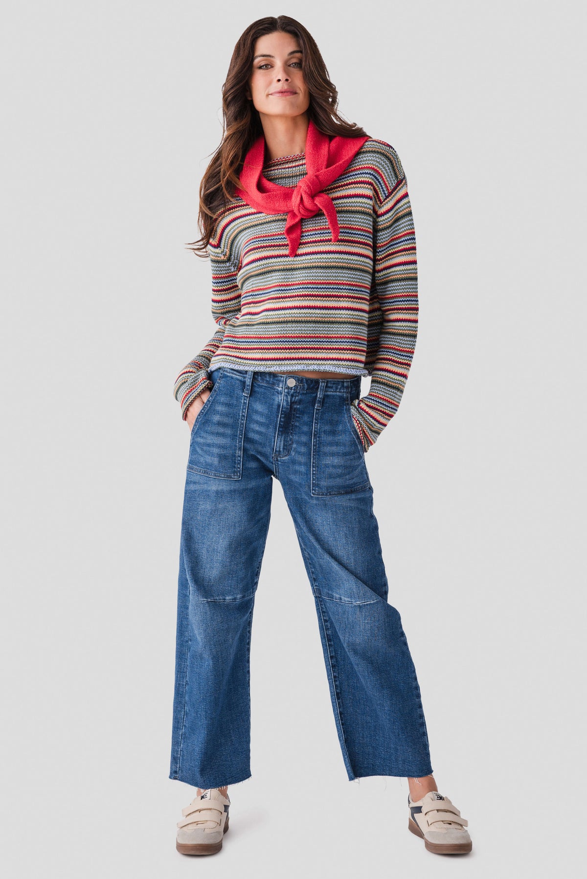 Multicolor striped rollneck sweater on a model, long sleeves and rib trim