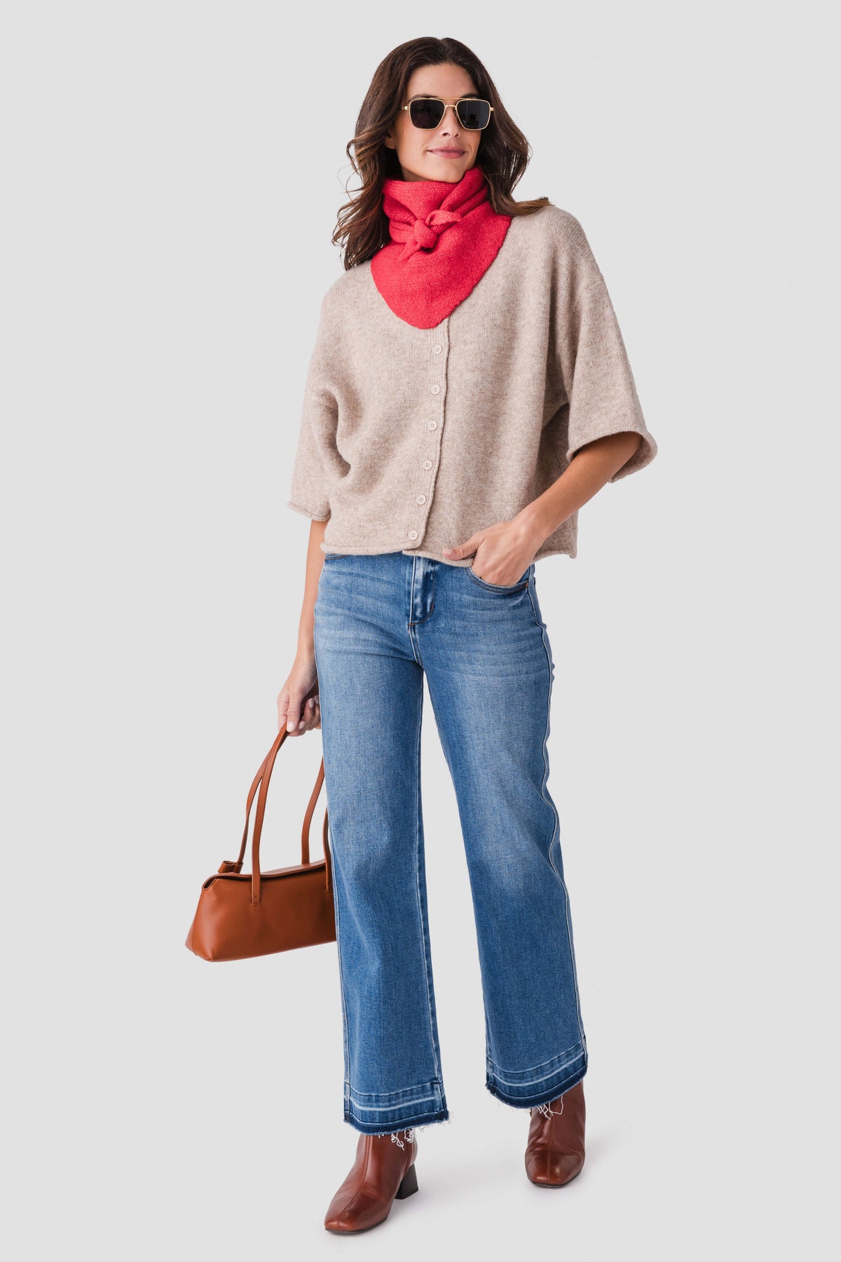 Red wool triangle scarf with front knot, draped at the neck