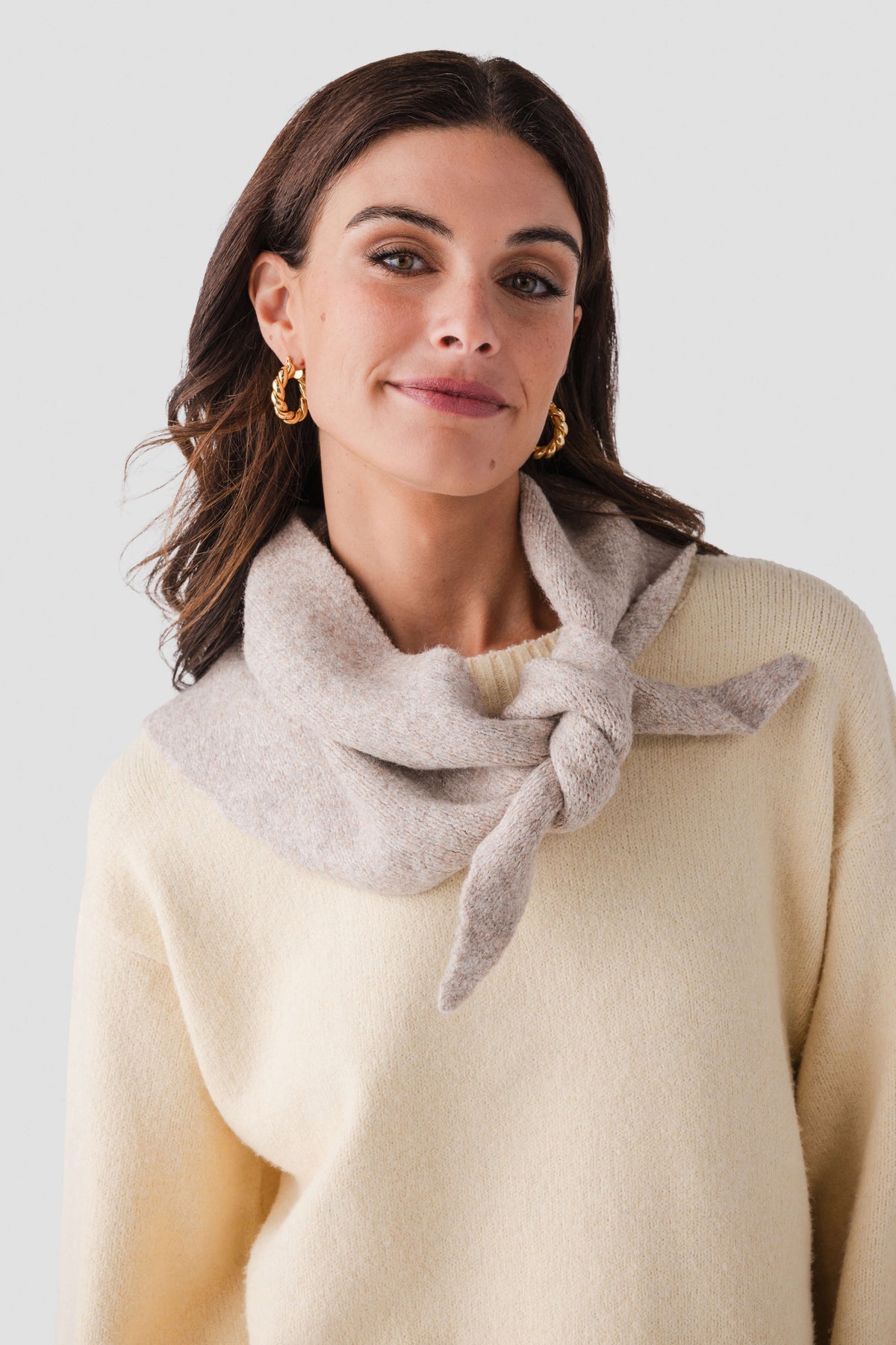 Light gray wool triangle scarf with front knot, close-up