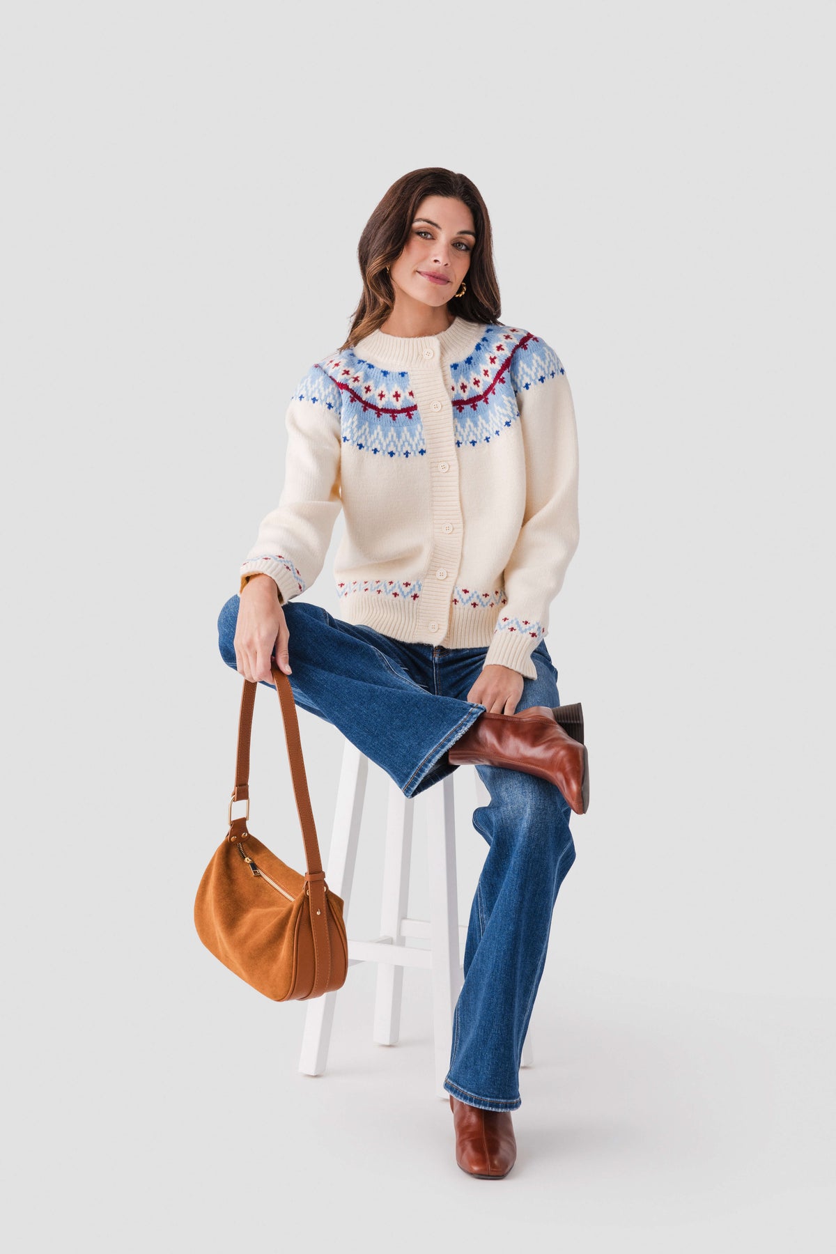 Ivory button-front cardigan with colorful Nordic yoke and fair isle trim at cuffs