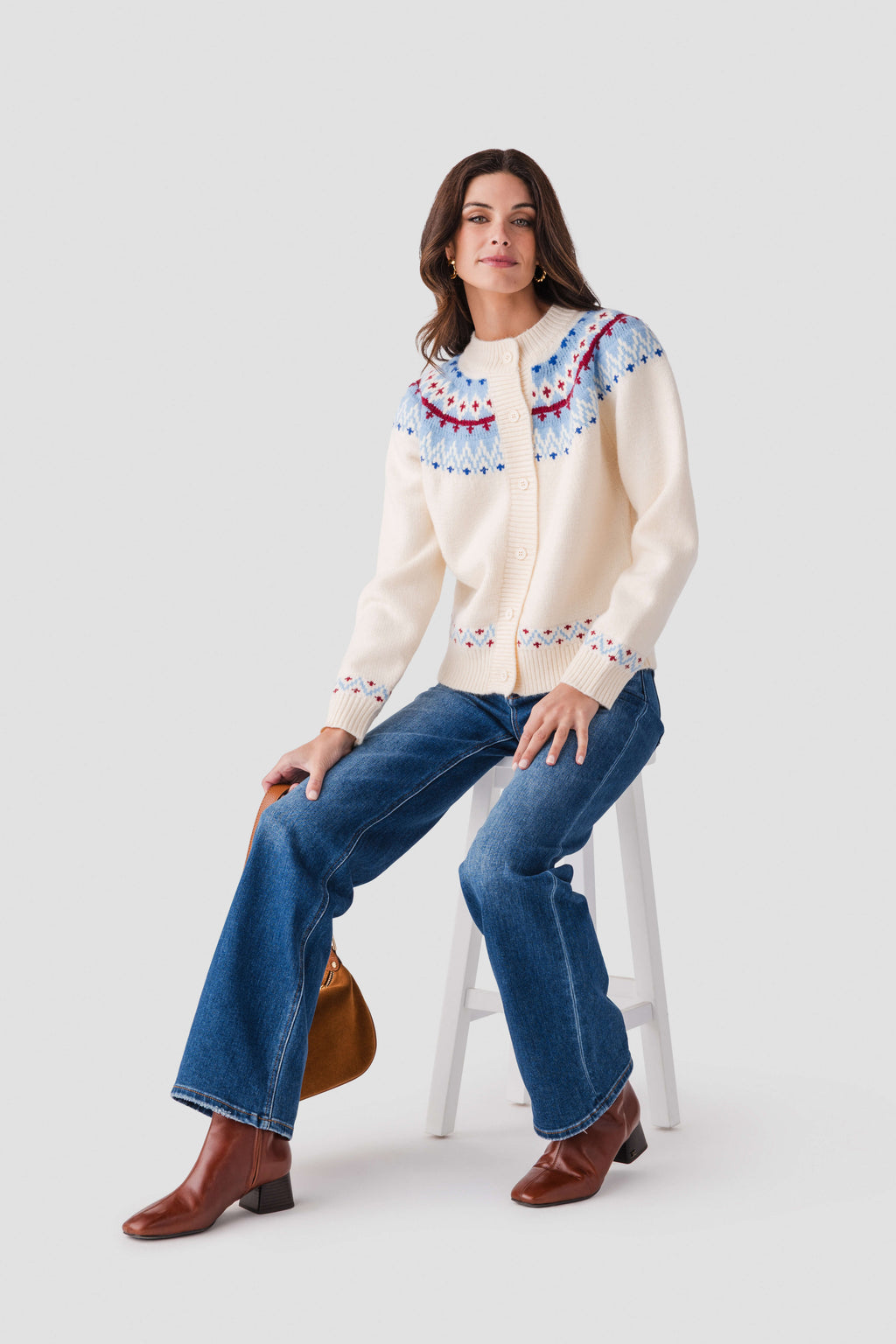 Ivory button-front cardigan with colorful Nordic yoke, patterned cuffs, and ribbed hem