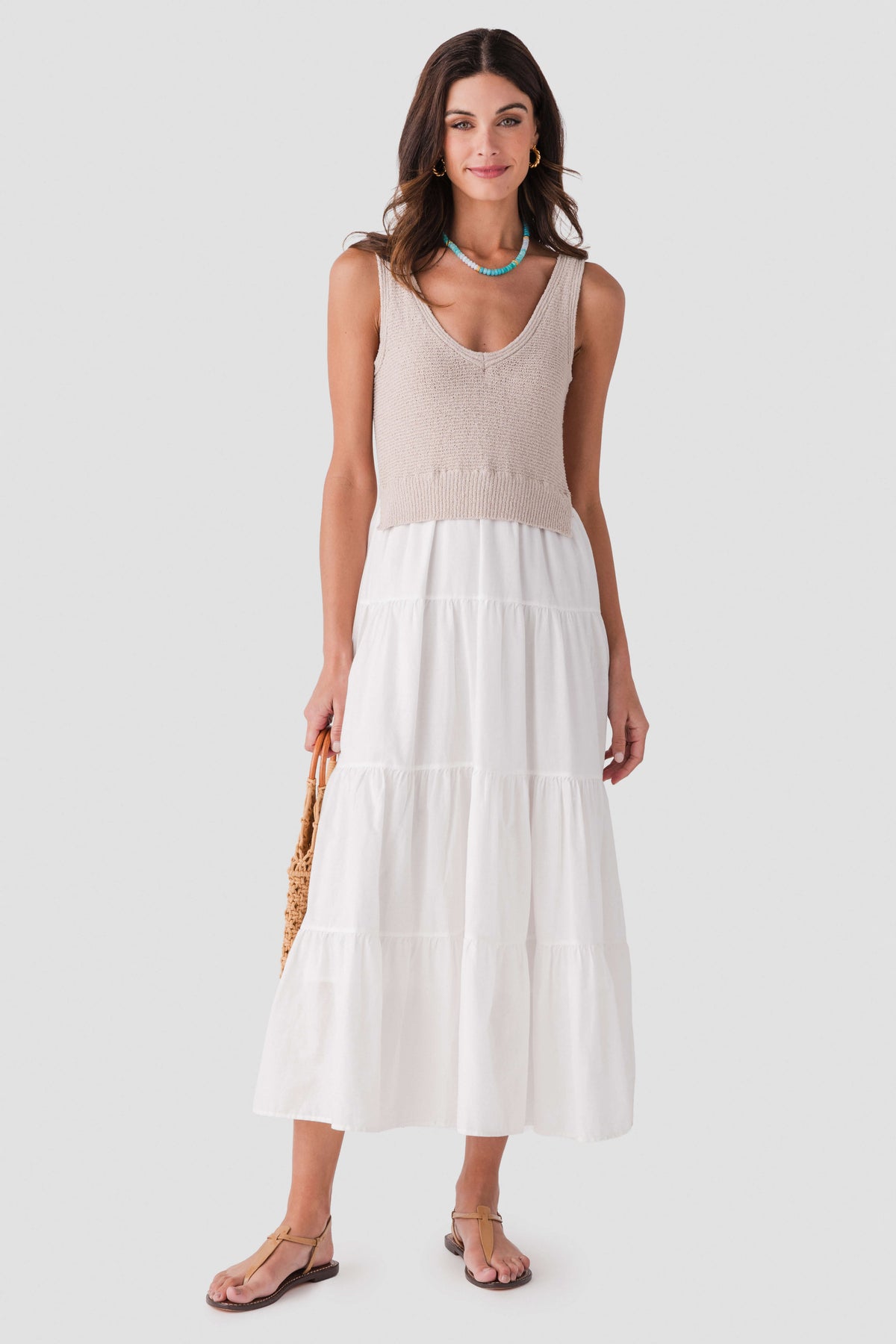 Light sleeveless maxi dress with scoop neck, textured bodice, and tiered skirt