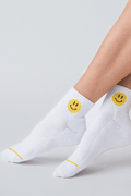 White ankle socks with yellow smiley face on cuff and small yellow heel detail