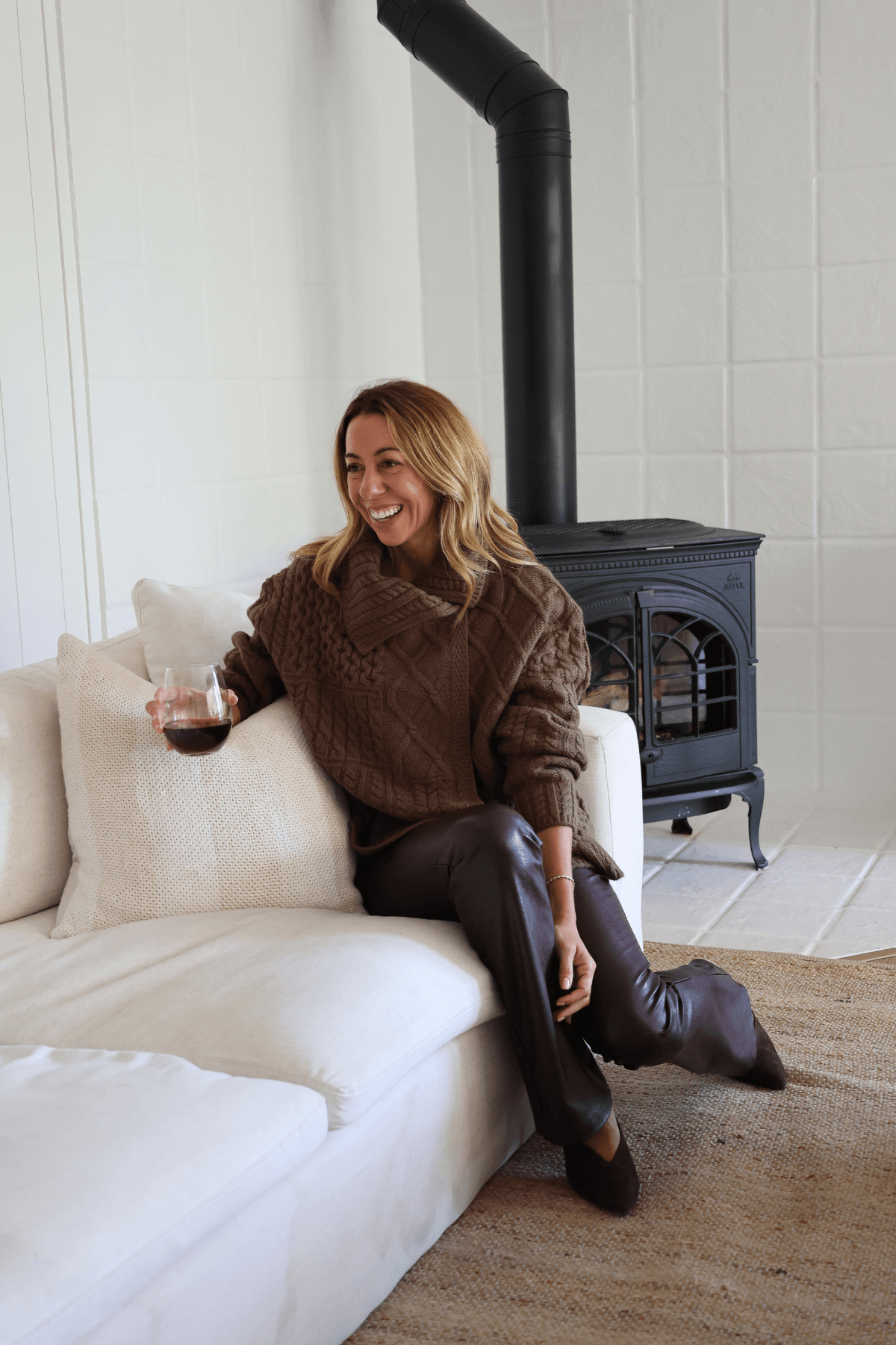 Ash brown cable-knit wrap cardigan with long sleeves, shawl collar, and tie belt