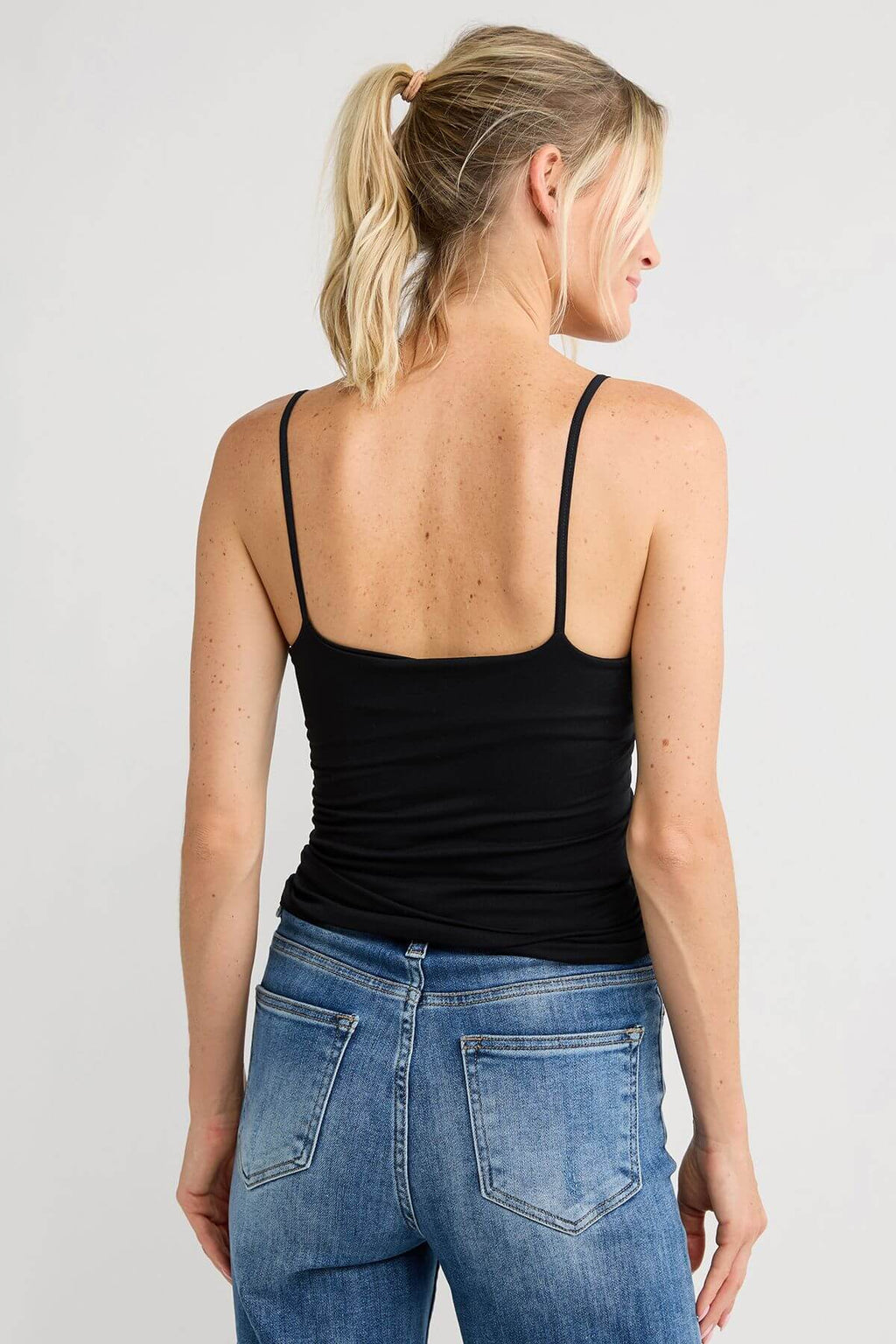 Free People seamless V-neck cami, black, sleeveless with thin straps (back view)