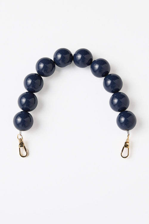 Large navy bead strap with gold-tone clips and round dark beads