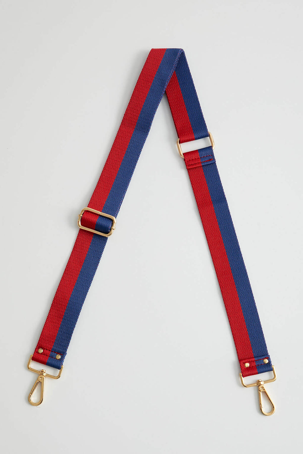 Navy and red striped 1.5-inch bag strap with gold clasps and adjustment hardware